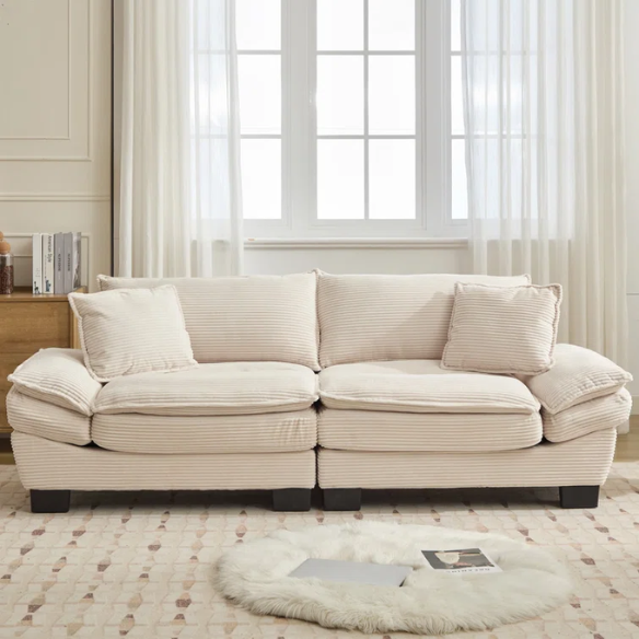 84-inch beige corduroy loveseat with striped upholstery, pillow-top arms, and two accent pillows—modern, low-profile design for living rooms or small spaces.