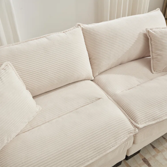 84-inch beige corduroy loveseat with striped upholstery, pillow-top arms, and two accent pillows—modern, low-profile design for living rooms or small spaces.