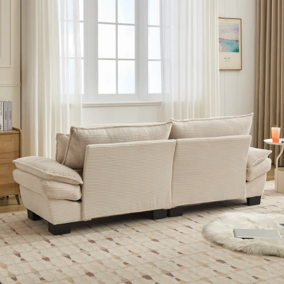 84-inch beige corduroy loveseat with striped upholstery, pillow-top arms, and two accent pillows—modern, low-profile design for living rooms or small spaces.