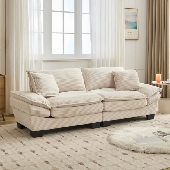 84-inch beige corduroy loveseat with striped upholstery, pillow-top arms, and two accent pillows—modern, low-profile design for living rooms or small spaces.