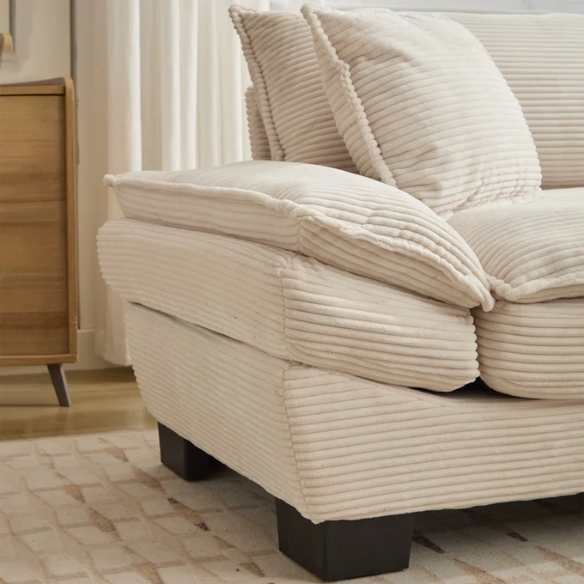 84-inch beige corduroy loveseat with striped upholstery, pillow-top arms, and two accent pillows—modern, low-profile design for living rooms or small spaces.