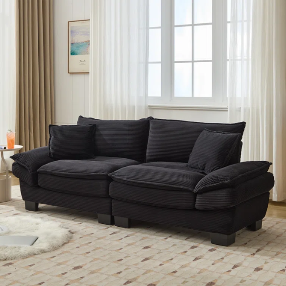 84-inch black corduroy loveseat with striped upholstery, pillow-top arms, and two accent pillows—modern, low-profile design ideal for contemporary living rooms or compact spaces.