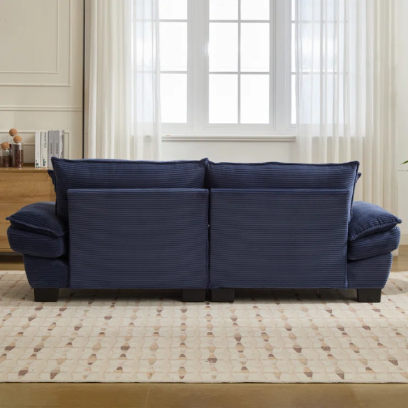 84-inch blue corduroy loveseat with striped upholstery, pillow-top arms, and two accent pillows—modern, low-profile design ideal for stylish living rooms or small spaces.