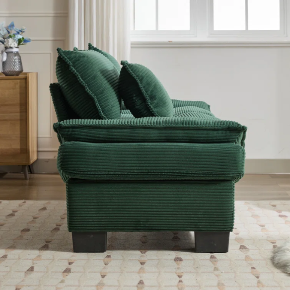 84-inch dark green corduroy loveseat with striped upholstery, pillow-top arms, and two accent pillows—modern, low-profile design ideal for stylish living rooms, offices, or apartments.