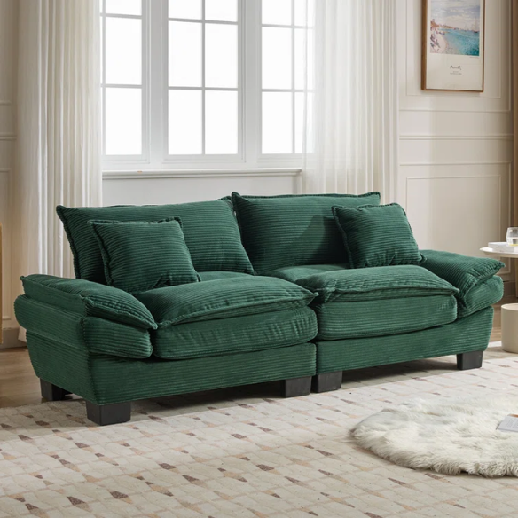 84-inch dark green corduroy loveseat with striped upholstery, pillow-top arms, and two accent pillows—modern, low-profile design ideal for stylish living rooms, offices, or apartments.