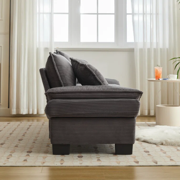 84-inch grey corduroy loveseat with striped upholstery, pillow-top arms, and two accent pillows—modern, low-profile design ideal for living rooms, apartments, or home offices.