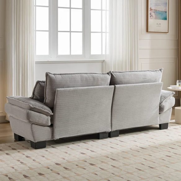 84-inch light grey corduroy loveseat with striped upholstery, pillow-top arms, and two accent pillows—modern, neutral-toned sofa ideal for living rooms, apartments, and minimalist spaces.
