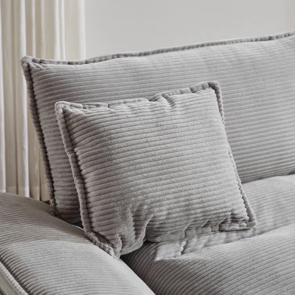 84-inch light grey corduroy loveseat with striped upholstery, pillow-top arms, and two accent pillows—modern, neutral-toned sofa ideal for living rooms, apartments, and minimalist spaces.