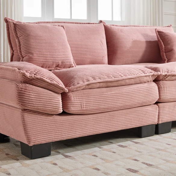 84-inch pink corduroy loveseat with striped upholstery, pillow-top arms, and two accent pillows—modern, playful design ideal for living rooms, apartments, or stylish bedrooms.