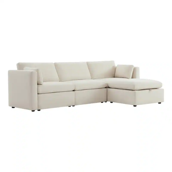 Beige modular four-piece sectional sofa with wide seats, soft chenille fabric, removable cushions, and built-in storage ottoman — ideal for modern and adaptable living room layouts.