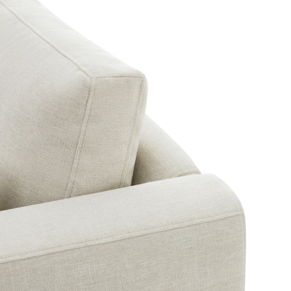 Beige five-piece modular sectional sofa with wide chenille-upholstered seats, two gas-lift storage ottomans, and reversible cushions — a modern and comfortable centerpiece for any living room.
