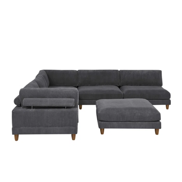 Dark grey modular sectional sofa with soft corduroy upholstery, matching ottoman, and removable cushions — seats six with flexible L- or U-shaped configurations.