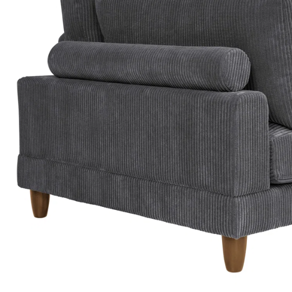Dark grey modular sectional sofa with soft corduroy upholstery, matching ottoman, and removable cushions — seats six with flexible L- or U-shaped configurations.