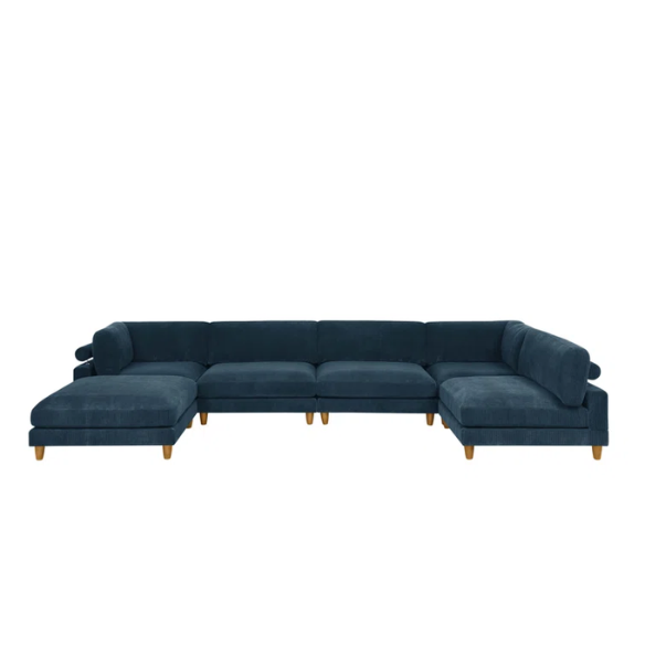Deep teal modular sectional sofa with plush corduroy fabric, removable cushions, and a matching ottoman — seats six in flexible L- or U-shaped configurations.