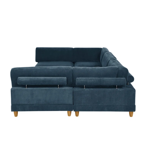 Deep teal modular sectional sofa with plush corduroy fabric, removable cushions, and a matching ottoman — seats six in flexible L- or U-shaped configurations.