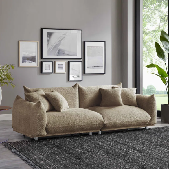 88.9-inch taupe upholstered modern sofa with chrome legs, deep seating, rounded arms, and four matching accent pillows, ideal for contemporary living rooms or home offices.