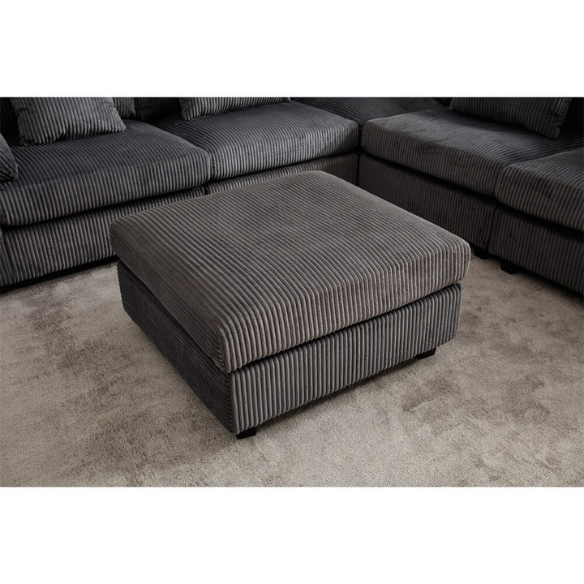 Modular grey corduroy sectional sofa with reversible L-shaped configuration, soft removable cushions, and high-density foam seating — perfect for modern living rooms.