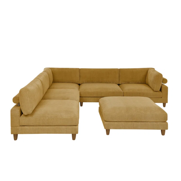 Modular mustard yellow corduroy sectional sofa with removable cushions, deep seating, and a matching ottoman — ideal for bold, spacious living room layouts.