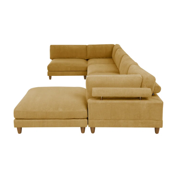 Modular mustard yellow corduroy sectional sofa with removable cushions, deep seating, and a matching ottoman — ideal for bold, spacious living room layouts.