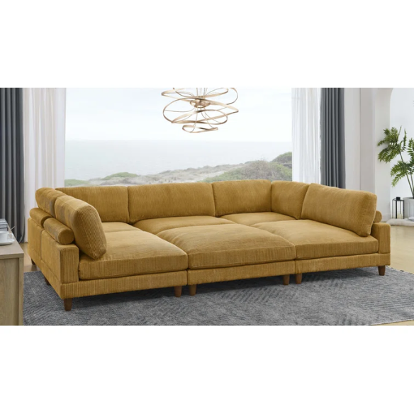 Modular mustard yellow corduroy sectional sofa with removable cushions, deep seating, and a matching ottoman — ideal for bold, spacious living room layouts.