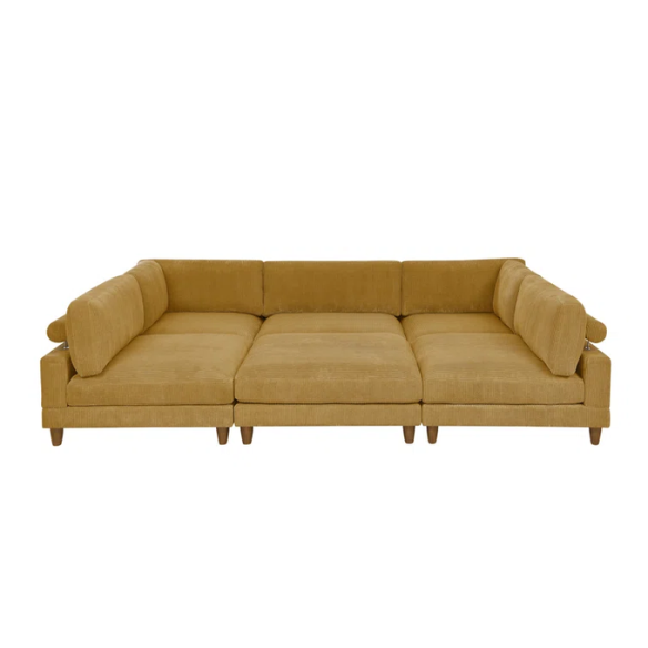 Modular mustard yellow corduroy sectional sofa with removable cushions, deep seating, and a matching ottoman — ideal for bold, spacious living room layouts.