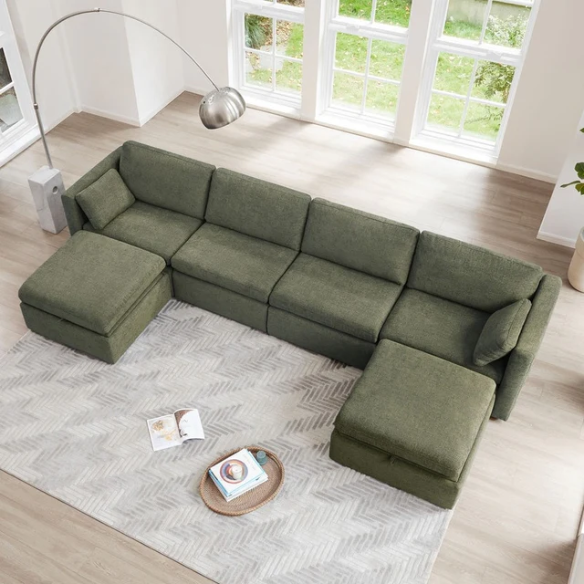 Olive green six-piece modular sofa set with wide chenille-upholstered seats, two storage ottomans with gas-lift lids, and plush reversible cushions — ideal for modern and mid-century inspired interiors.