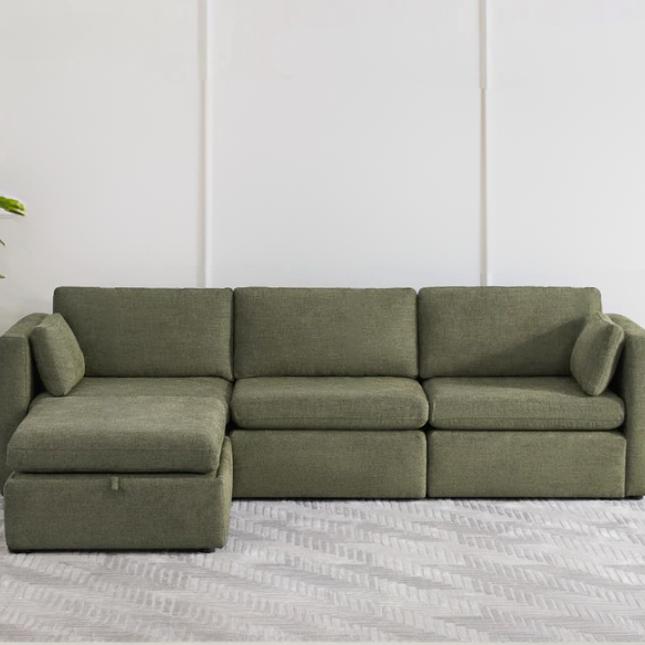 Olive green four-piece modular sofa with wide seats, soft chenille upholstery, removable cushions, and storage ottoman — ideal for customizable modern living rooms.