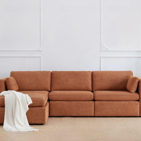Terracotta modular four-piece sofa set with wide seats, soft chenille upholstery, removable cushions, and a gas-lift storage ottoman — perfect for modern, cozy living rooms.