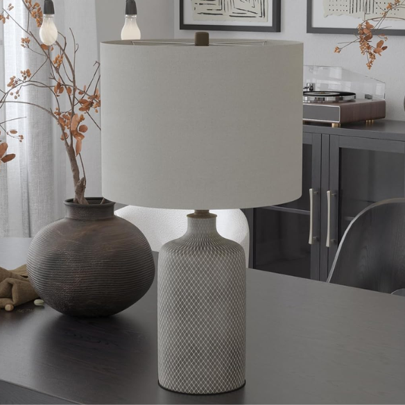 Gray ceramic table lamp with black diamond textured base and white fabric drum shade, featuring a 3-way switch for adjustable lighting in transitional or modern interiors