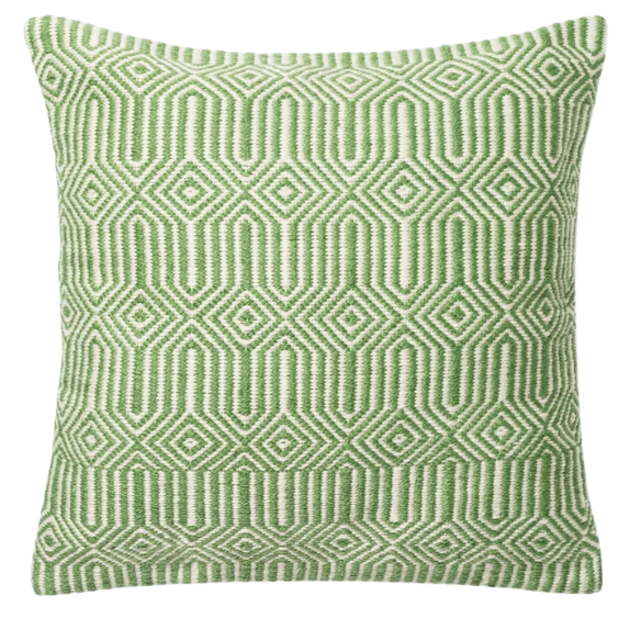 Green and cream geometric throw pillow on outdoor seating with modern patio decor