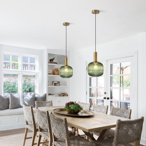 Green glass pendant light with gold accent finishes, modern ceiling fixture for kitchen, dining room, and living room.