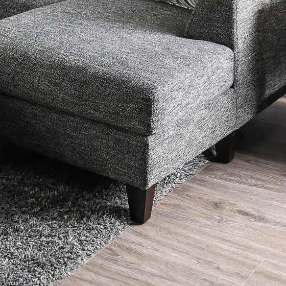 4-piece grey modular sectional sofa with dual chaises, chenille upholstery, flared arms, and accent pillows