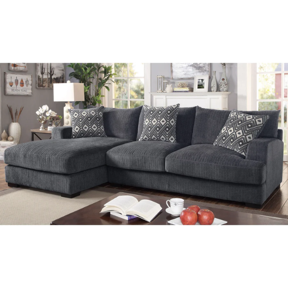 Modern grey chenille sectional sofa with chaise lounge, geometric accent pillows, and track arms in a contemporary living room setting.