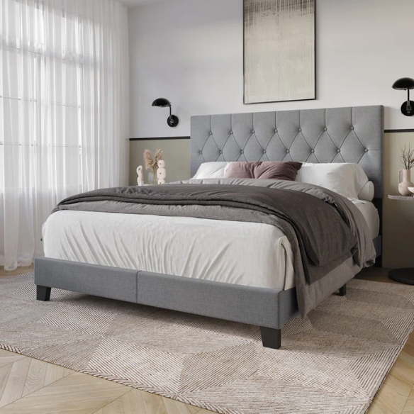 Grey linen full size upholstered bed with button tufted headboard and low-profile legs
