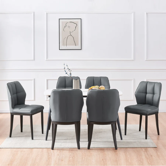 Grey faux leather dining chairs with checkered backrest and metal legs in a set of two