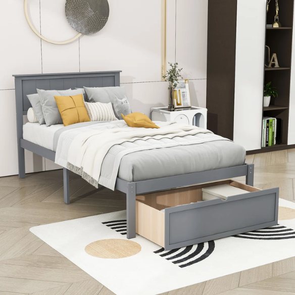 Grey twin platform bed made from solid pine wood with a rectangular headboard and a pull-out underbed storage drawer, featuring sturdy center support legs and a clean modern finish.
