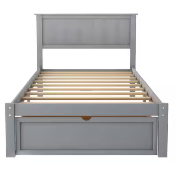 Grey twin platform bed made from solid pine wood with a rectangular headboard and a pull-out underbed storage drawer, featuring sturdy center support legs and a clean modern finish.