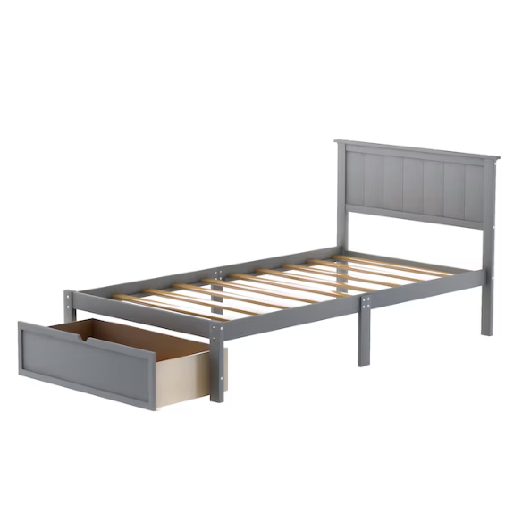 Grey twin platform bed made from solid pine wood with a rectangular headboard and a pull-out underbed storage drawer, featuring sturdy center support legs and a clean modern finish.
