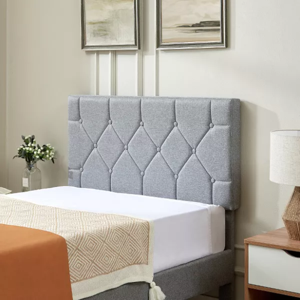 Modern grey upholstered twin bed with button-tufted headboard, steel frame, and slatted base – no box spring required