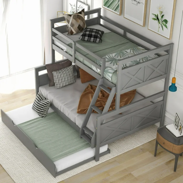 Grey twin over full wood bunk bed with pull-out trundle, safety guardrails, and angled ladder – space-saving design for kids or guest rooms.