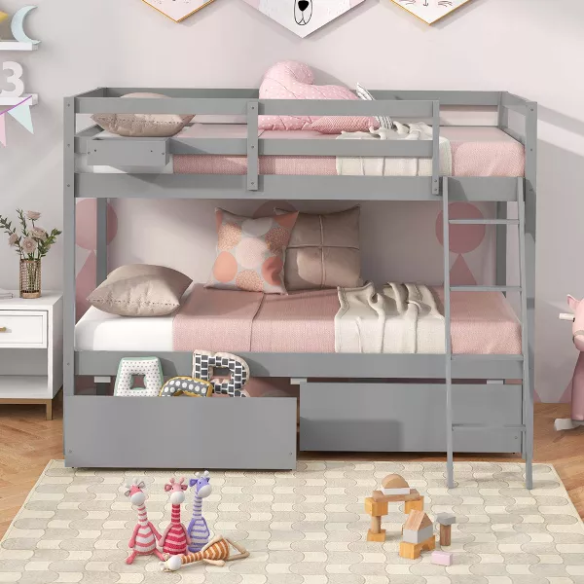 Grey twin-over-twin bunk bed with storage drawers, safety guardrails, and ladder, made of sturdy pine wood with modern design for kids’ bedrooms