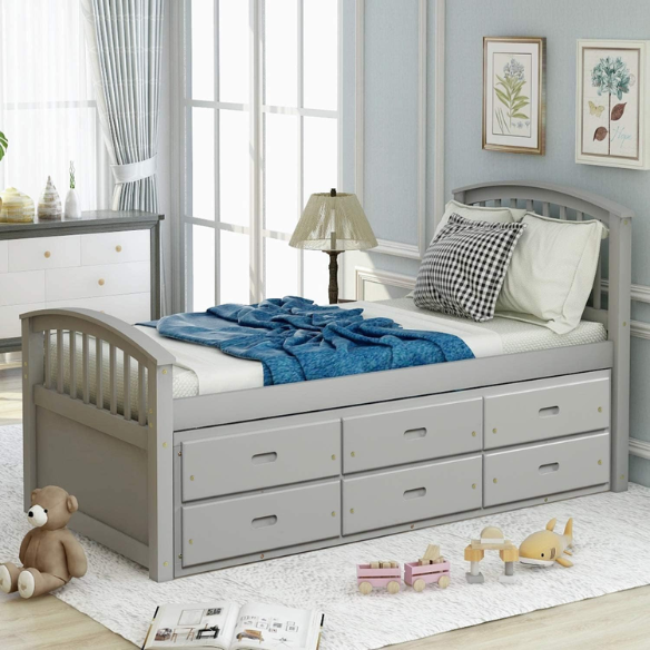 Grey twin bed frame made from solid pine wood with underbed storage drawers, finished in non-toxic paint with a slatted base, ideal for children or teens in a modern bedroom.
