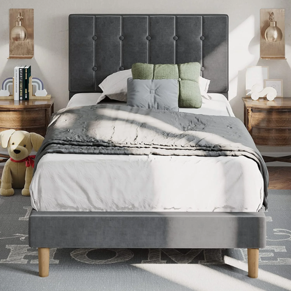 Grey twin bed frame with tufted velvet headboard, sturdy metal and wood construction, and 7.9-inch under-bed storage clearance.