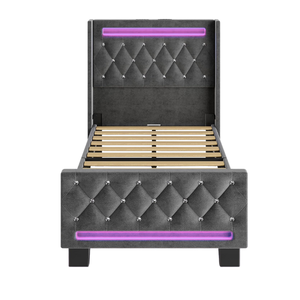 Modern grey twin bed with LED lights, USB charging ports, and upholstered velvet headboard and footboard – no box spring required