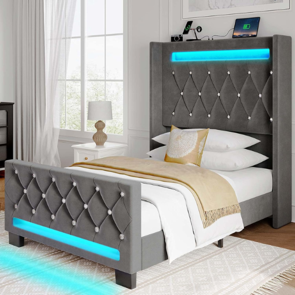 Modern grey twin bed with LED lights, USB charging ports, and upholstered velvet headboard and footboard – no box spring required