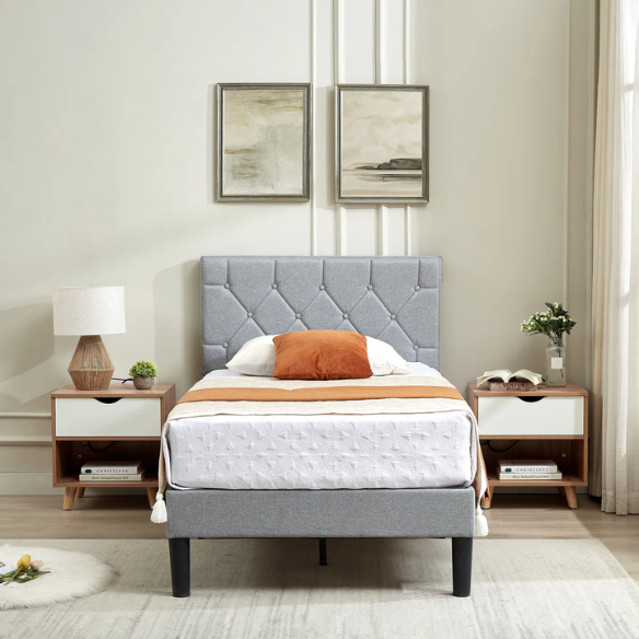 Grey upholstered twin platform bed frame with diamond-tufted linen headboard, sturdy metal construction, and center support legs, no box spring needed.