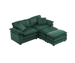 Modern emerald green ribbed velvet corduroy sofa with foam cushioning and pocket spring system, featuring a sturdy wood frame, plush back pillows, and sleek black plastic legs for superior comfort and stylish design.