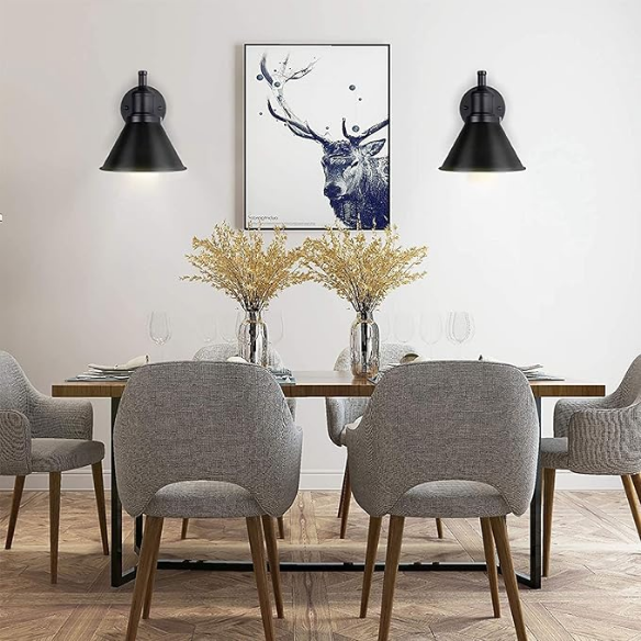 Industrial matte black swing arm wall sconce with adjustable arm and E26 bulb socket, perfect for vintage-inspired interiors.