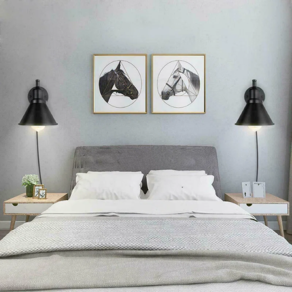 Industrial matte black swing arm wall sconce with adjustable arm and E26 bulb socket, perfect for vintage-inspired interiors.
