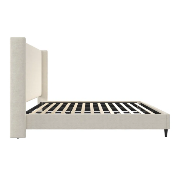 Ivory bouclé upholstered king-size platform bed with tall wingback headboard, wood slats, and no box spring required.